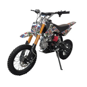 Off-road dirt bike with colorful graffiti decals, gold front forks, and a side kickstand.